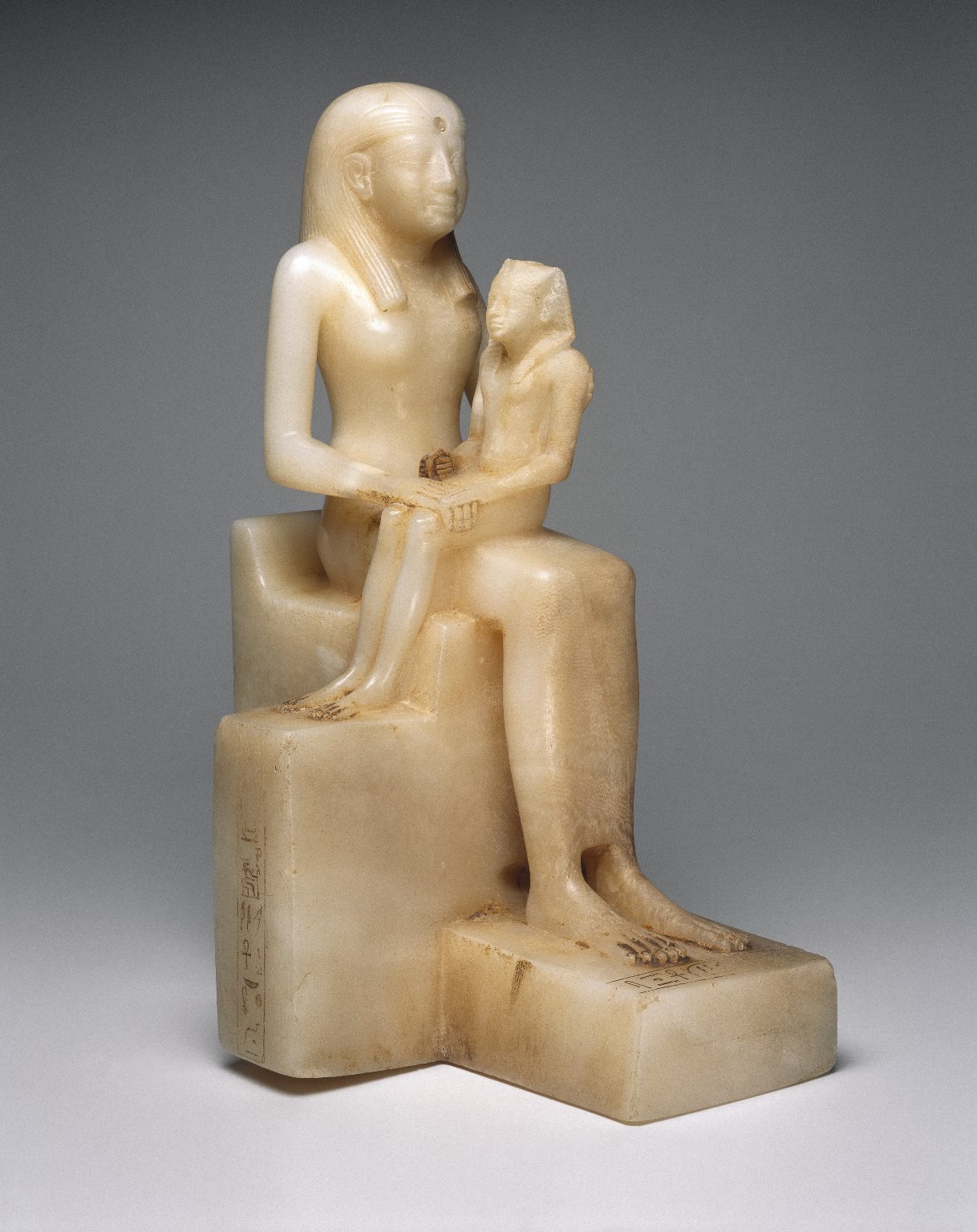 Statuette of Queen Ankhnes-meryre II and her Son, Pepy II, three quarter view.jpg